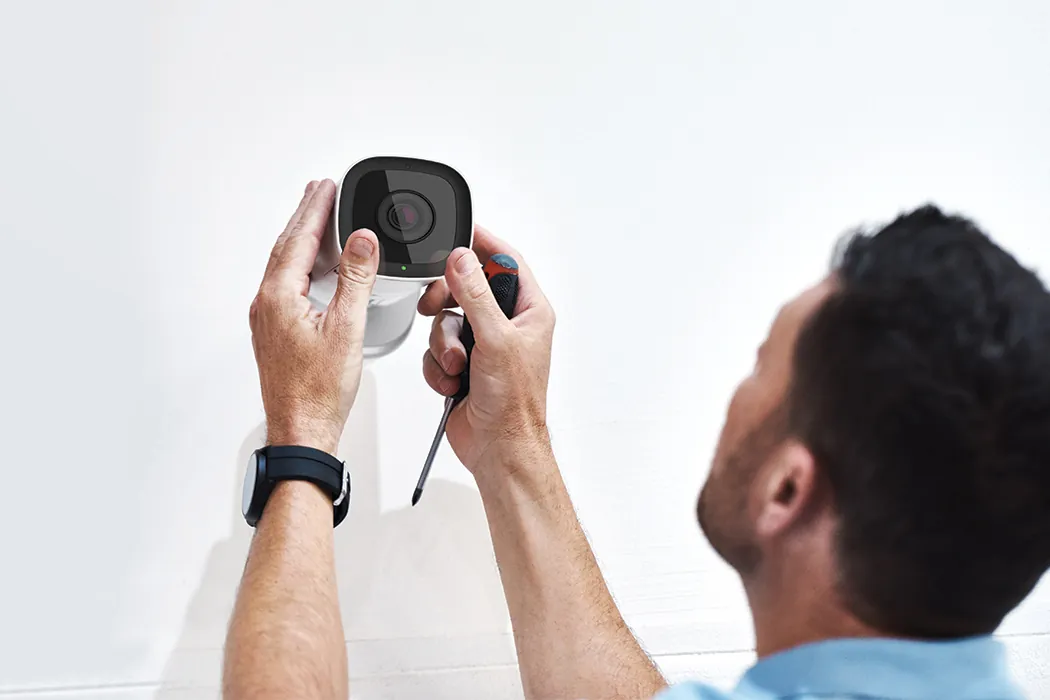 Checking the adhesive camera mount grip during a routine inspection