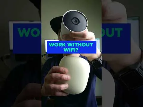 Hands inserting a microSD card into a security camera