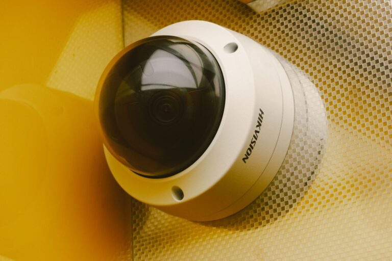 A modern indoor security camera mounted in a bright and peaceful living room.