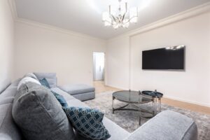 A modern living room with elegant ceiling lighting creating a warm and inviting atmosphere.