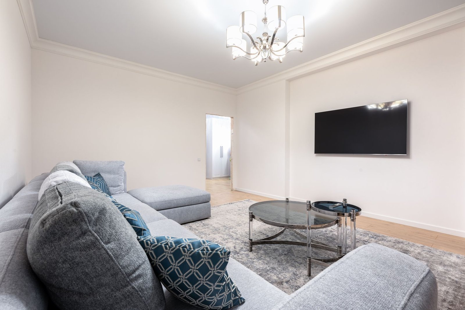 A modern living room with elegant ceiling lighting creating a warm and inviting atmosphere.