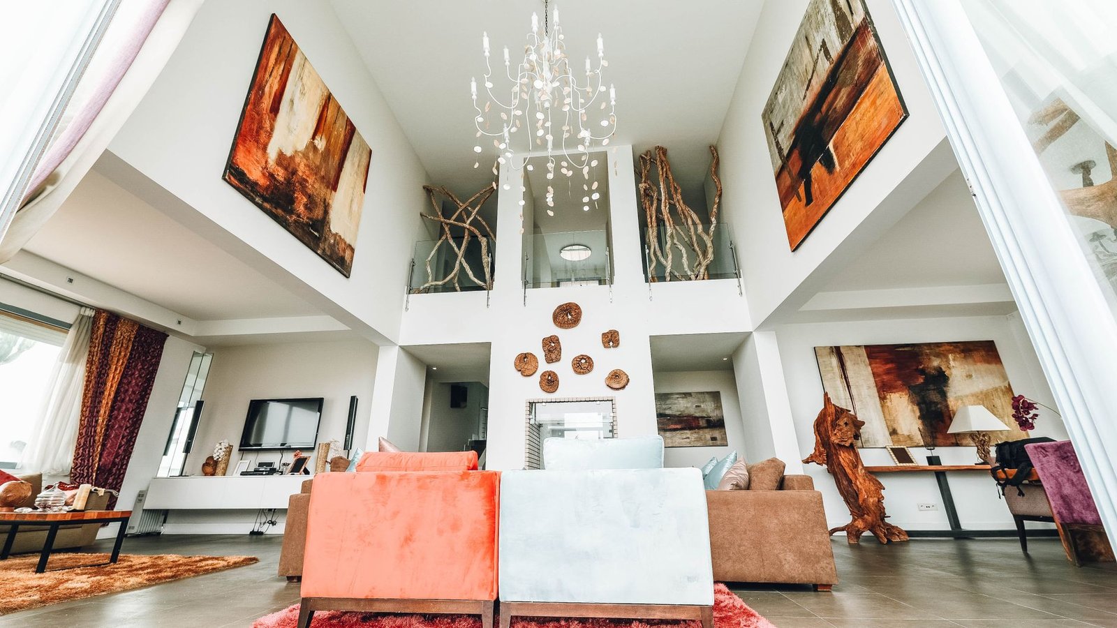 A modern living room with low ceilings featuring effective recessed lighting and minimalist decor.