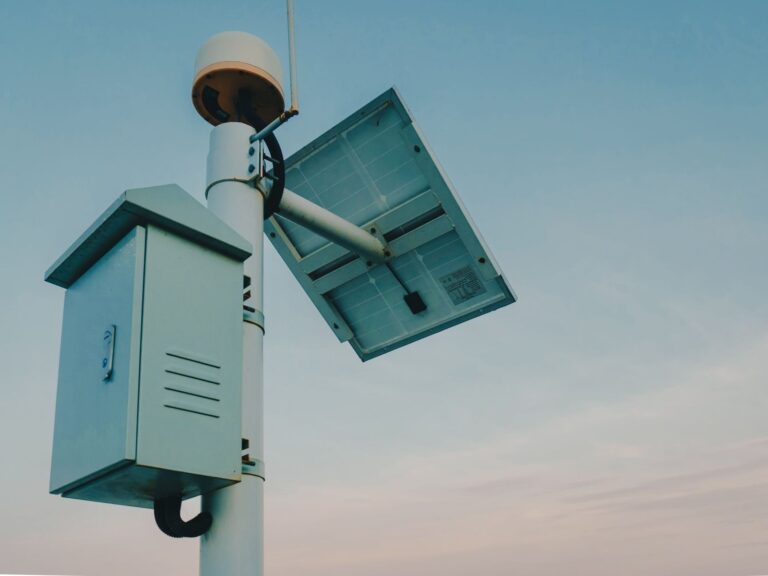 A modern solar-powered outdoor security camera mounted on a contemporary home exterior wall.